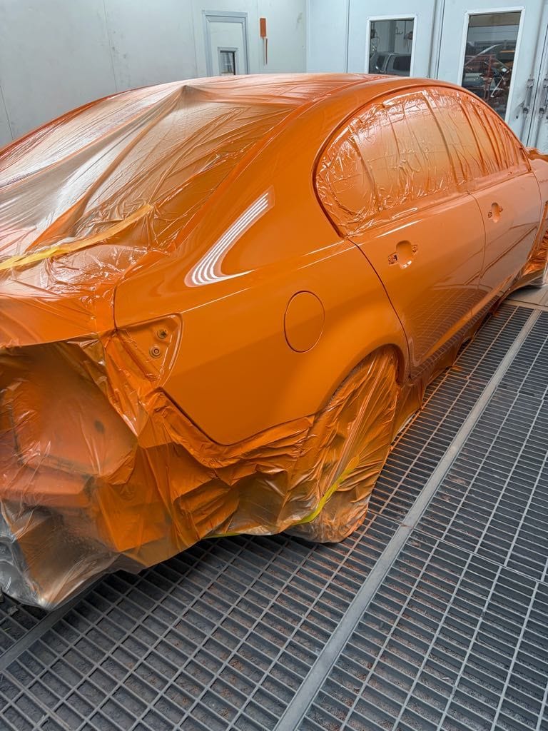A freshly painted car in the Aldinga Crash Repairs spray booth