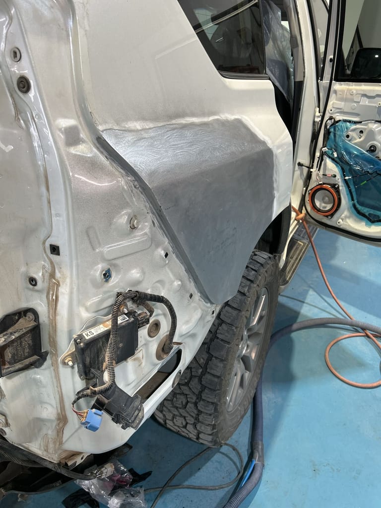 Rear quarter panel filled, shaped and primed, ready for paint